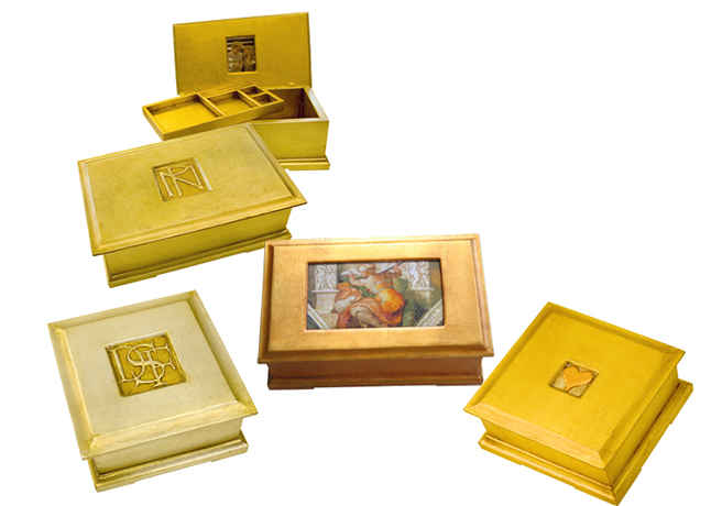 box catalogue shot, showing photo of box with black frame and design of woman’s face and hair.