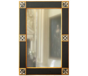 An ornate stud overmantle mirror, with black frame.