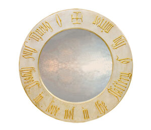 round gothic mirror with beauty script, with black frame.