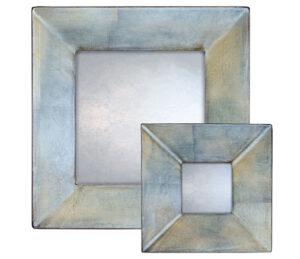 metallic blue swept mirror, showing round mirror with blue frame and metallic finish.